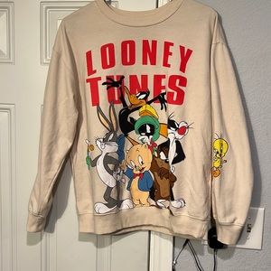 Looney tunes light sweater , tan color , size medium